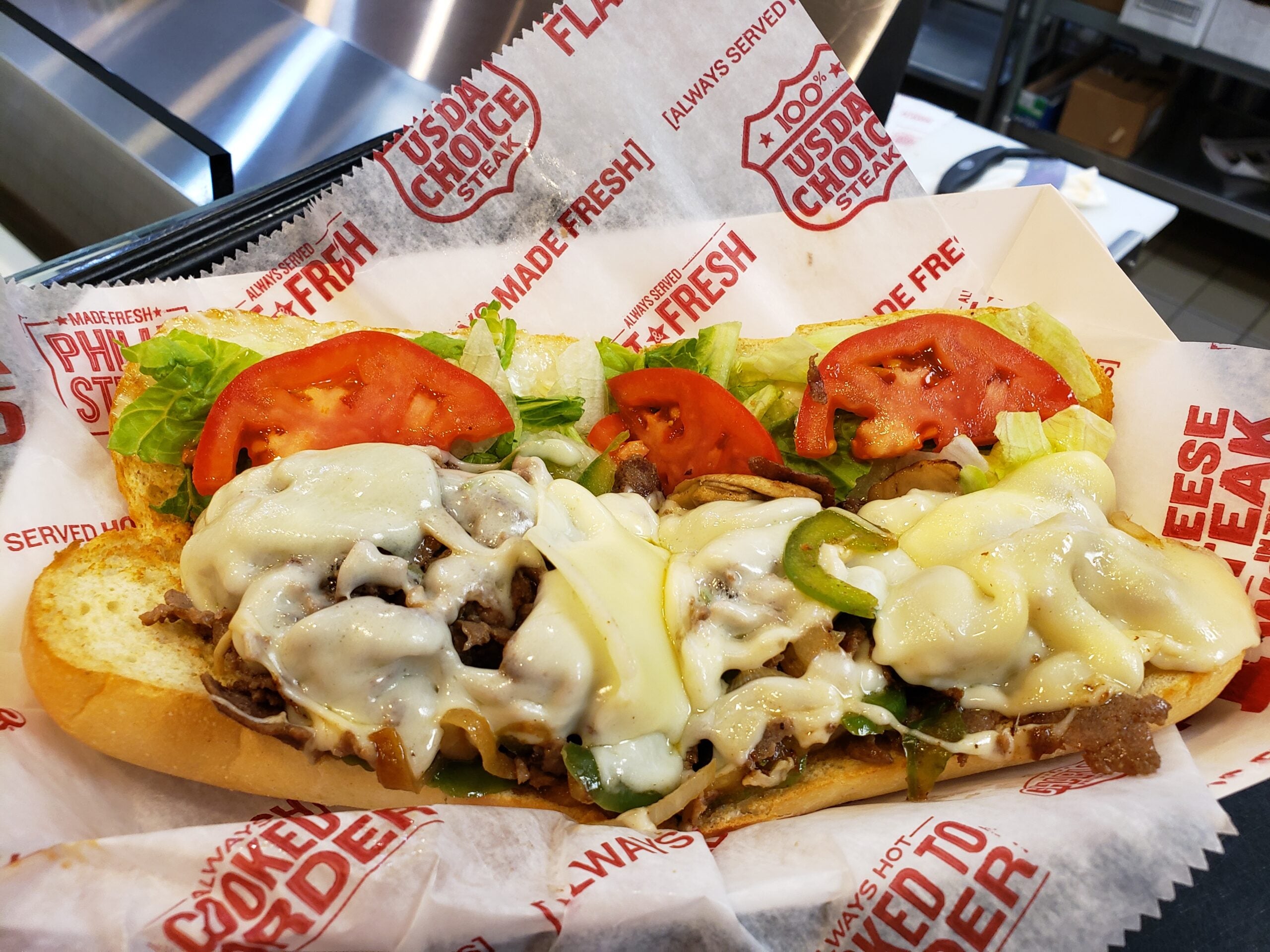 Philly Cheesesteak: Original cheesesteak with melted cheese, onions, peppers. Learn about the origin of cheesesteaks and why is it called Philly Cheesesteak. Find cheesesteaks near me