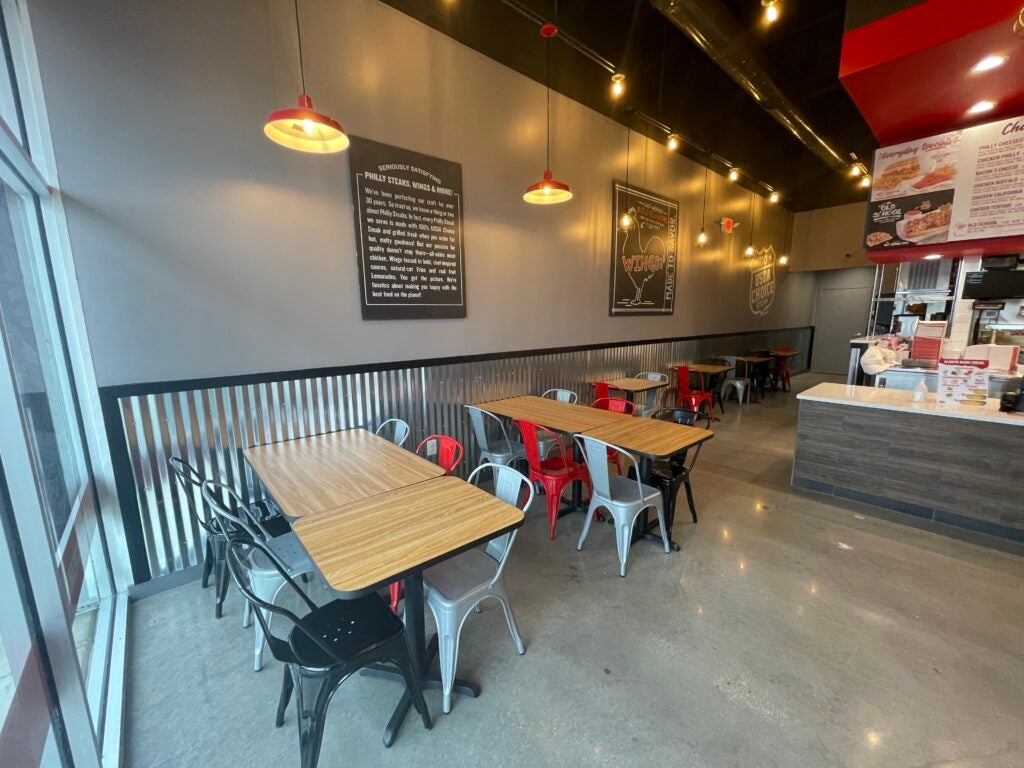 Tables and the dining area at Charleys Cheesesteaks and Wings at Corridor Marketplace.